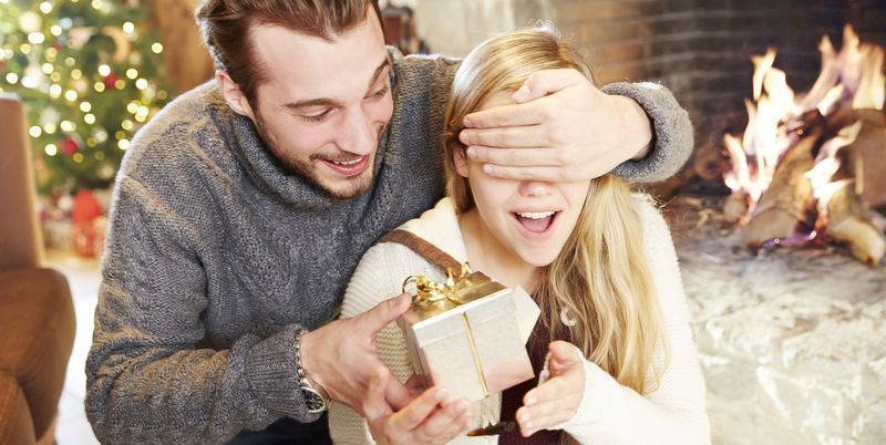 couple-exchanging-gifts-on-christmas-royalty-free-image-521811749-1544528675.jpg