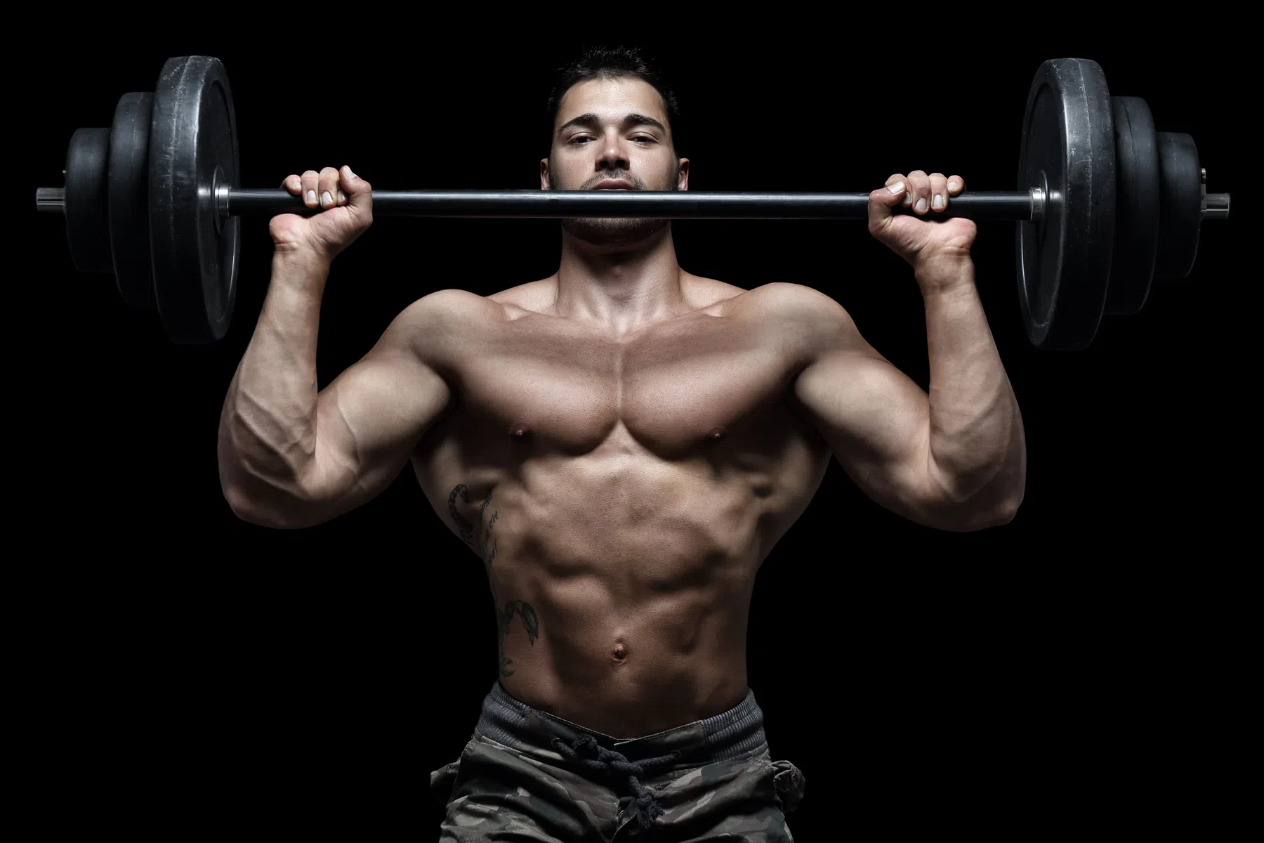 Man performing overhead press exercise
